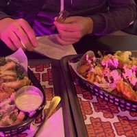 Caesar salad and waffle fries with mushroom “chicken"  at The Saucy Cow in Dublin