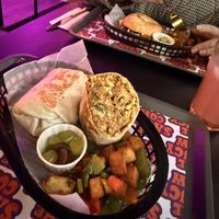Soyrizo burrito came with grapes and home fries. Friend had the bacon and cream cheese bagel  at The Saucy Cow in Dublin