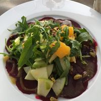 Beetroot Carpaccio, walnut dressing topped with rucola, apple, orange pieces   at Estro in Cairo