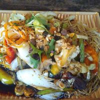 Mixed vegan meats and fried rice noodles at Vegan 1983 in Erfurt