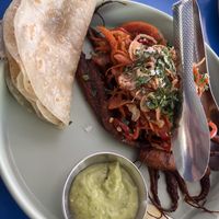 carrot barbacoa tacos made with roasted and smoked baby carrots, barbacoa marinade, crunchy carrot slaw, crispy shallots, and salsa verde  at Mister Oso in Denver