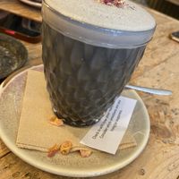 Activated charcoal with oat milk   at VIBE Plant Based Cafe & Restaurant in Douglas