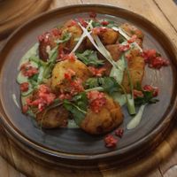 Smashed roasties with basil cream & salsa at VIBE Plant Based Cafe & Restaurant in Douglas