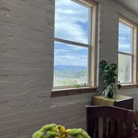 Enjoying my blissful looking out at the window from the upstairs tea house! Delicious healthy vegan vegetarian foods!  at The Wild Violet in Mars Hill