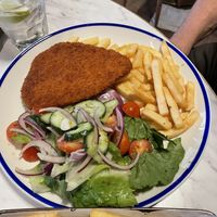Vegan chicken schnitzel with fries and side salad   at The Log Cabin in Penrith