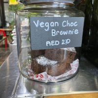 Vegan brownie near cashier at RAW Coffee Company in Dubai