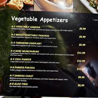 I was told the samosa, pakora, and gobi were vegan   at Flavors of India in Cocoa Beach