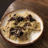 Sausage ravioli with Alfredo sauce, mushroom and shallot confit, Parmesan, and crispy sage (vegan!!) at Idlewild Spirits Brewpub and Restaurant in Winter Park