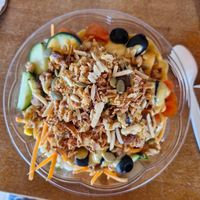 Spinach, couscous, lentils, mango dressing, cucumber, tomatoes, black olives, topped with mixed nuts and crispy onions 😋 at The Bowl Haus in Lanzarote