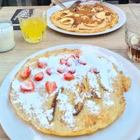 Delicious vegan traditional pancake with fruit toppings. at Stroop & Suiker in Tiel