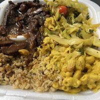 peppered stek , kale and spinach, brown rice and peas with gravy and mac n cheeze  at Di-Vine Plant Based Cuisine in Forest Park