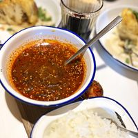 Awesome! Spicy vegan wild sorrel (aveluk) soup with kimchi and rice (❗️note: regular kimchi is not vegan, contains fish sauce, ask not to serve it, or don’t add it). Very hearty, really spicy! The taste reminded me Georgian Kharcho soup. Recommend! at Hummus Kimchi in Yerevan