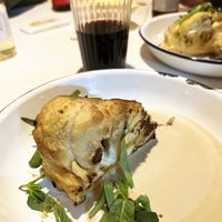 Grilled cauliflower with tahini  sauce, lemon zest, tarragon and mint at Hummus Kimchi in Yerevan