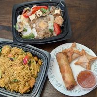 Cream cheese wontons, crispy spring roll, pineapple and tofu fried rice, glass noodle with tofu at Mana Thai Comfort Food in Longmont