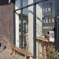 Outdoor seating at Beaten by a Whisker in London