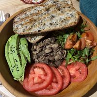 Very tasty vegan breakfast with orange juice and tea  at UKAW Chocolate in Miraflores