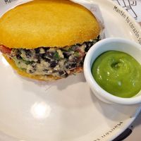 Biscuit sandwich stuffed with a hummus mixture at Biscuits by Nane in Guayaquil