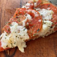 It was so good that we forgot to take a picture until there was only one slice left...  at Coral Vegan Pizza in Playa Del Carmen