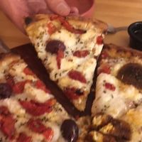 What you're seeing on that slice is a black olive and sundried tomatoes.  at Coral Vegan Pizza in Playa Del Carmen