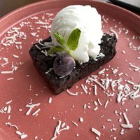 Chocolate brownie with coconut ice cream 😍  at Coral Vegan Pizza in Playa Del Carmen