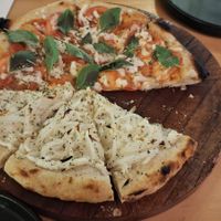 Pizza 1/2 olas blanca 1/2 primavera caribeña at Coral Vegan Pizza in Playa Del Carmen