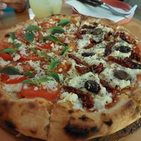 Pizza half Primavera half Cozumel at Coral Vegan Pizza in Playa Del Carmen