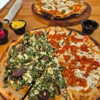 Pizza pastor and olive spinach at Coral Vegan Pizza in Playa Del Carmen