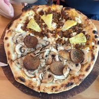 Half pepperoni half soy crumbles at Coral Vegan Pizza in Playa Del Carmen