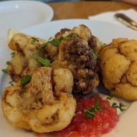 Fried cauliflower with tomato salsa and tahini at Agadir Burger in Ein Bokek