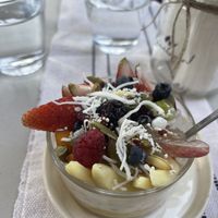 Coconut milk tapioca with passion fruit at the bottom and fresh fruit on top.  at MUCHO PAN in Guanajuato
