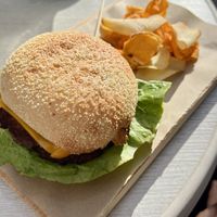 Burger with potatoes  at Malila Coffee in Valencia