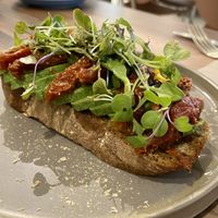 Avo, sun dried toms, microgreens and nooch    at Malila Coffee in Valencia