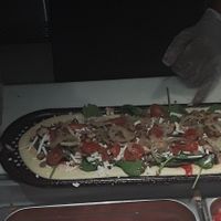 The Assembly of the pizza I ordered a vegan cheese, Vegan pepperoni,  spicy chickpeas and vegan sausage. Top with all the veggies I wanted. at & PIZZA in Nottingham