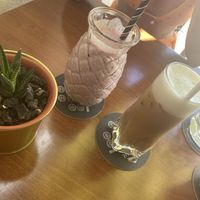 Red love smoothie and oat milk iced latte  at Neighbours in Tenerife