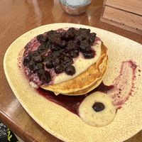 Vegan blueberry pancakes with Algarve syrup and vegan vanilla yoghurt   at Neighbours in Tenerife