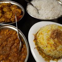 Channa pindi, aloo gobi, plain basmati  rice and veg biryani  at Mumbai Cafe in Western Cape
