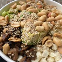 My bowl: basmati rice, seitan, tofu, ginger, mixed beans, avocado, ginger, edamame, peanuts, sesame seeds, oil and lemon juice  at Sanoo in Urbino