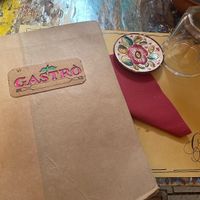 the menu and the table of the restaurant  at Gastrò in Savona