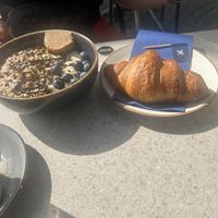 Açai bowl and croissant   at WASBAR in Bruges