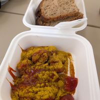 Vegan Currywurst with bread at FRA - Best Worscht in Town - T1 in Frankfurt