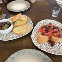 Bowl of mixed olives and vegan bruschetta (without vegan feta)   at Thomas Grill in Kos