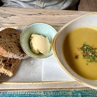 Lentil curried soup with bread   at High St Merchants in Grantown On Spey