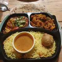Thali meal for one. Starter: Kachori. 2 Curries: Aloo Gobi and Mushroom Masala. Rice: Pulav at RK Dining in Preston