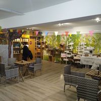 Downstairs seating and little shop with their own brands at Lupikuss in Wiesloch