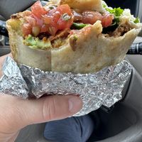 Vegan breakfast burrito (half eaten)  at The Sisters Restaurant in Everett