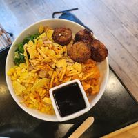 Large bowl with falafel, tofu, rice, some veg at Poké Perfect in The Hague
