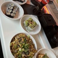 Squeaky bean mock duck yakisoba, inari taco, veggie volcano roll, avocado and cucumber maki  at Yo! Sushi in Bristol