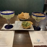Muy Matcho Margarita (left), happy hour guac (center), and Spicy Cucumber Margarita (right)  at Blue Agave Grill in Fort Collins