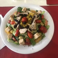 Salad with chickpea cheese cubes  at Naturaleza Sabia in Buenos Aires