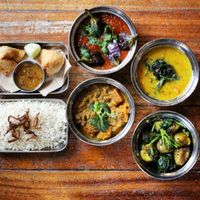 A vegan spread, so many options. Bengali Aubergine, Spinach Tarka Dal, Pumpkin & Coconut Olan, Gunpowder Potatoes and Samosa at Thali Cafe - Clifton in Bristol